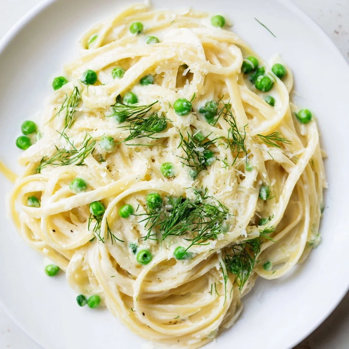 Golden, creamy Creamy Dill Pasta with bright green dill; imagine the wonderful aroma.