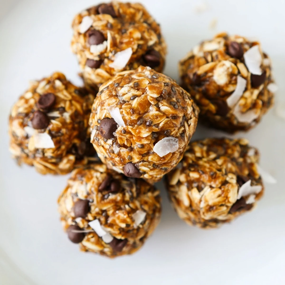 Close-up of golden Almond-Chia Energy Bites, a healthy no-bake treat with visible chia seeds.