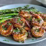 Vibrant one-pan lemon garlic shrimp and asparagus with fresh parsley and zesty lemon sauce.
