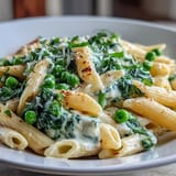 Quick One-Pot Lemon Ricotta Pasta, showcasing tender peas and spinach.