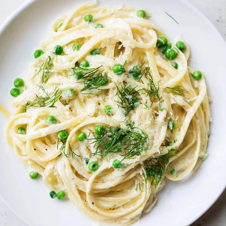 Golden, creamy Creamy Dill Pasta with bright green dill; imagine the wonderful aroma.