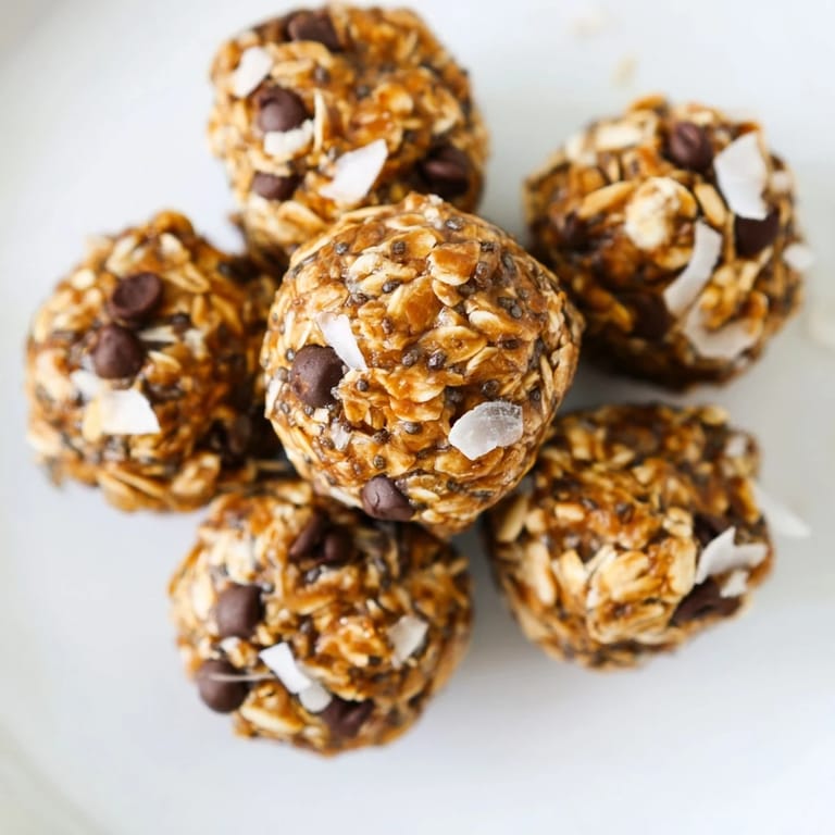 Close-up of golden Almond-Chia Energy Bites, a healthy no-bake treat with visible chia seeds.