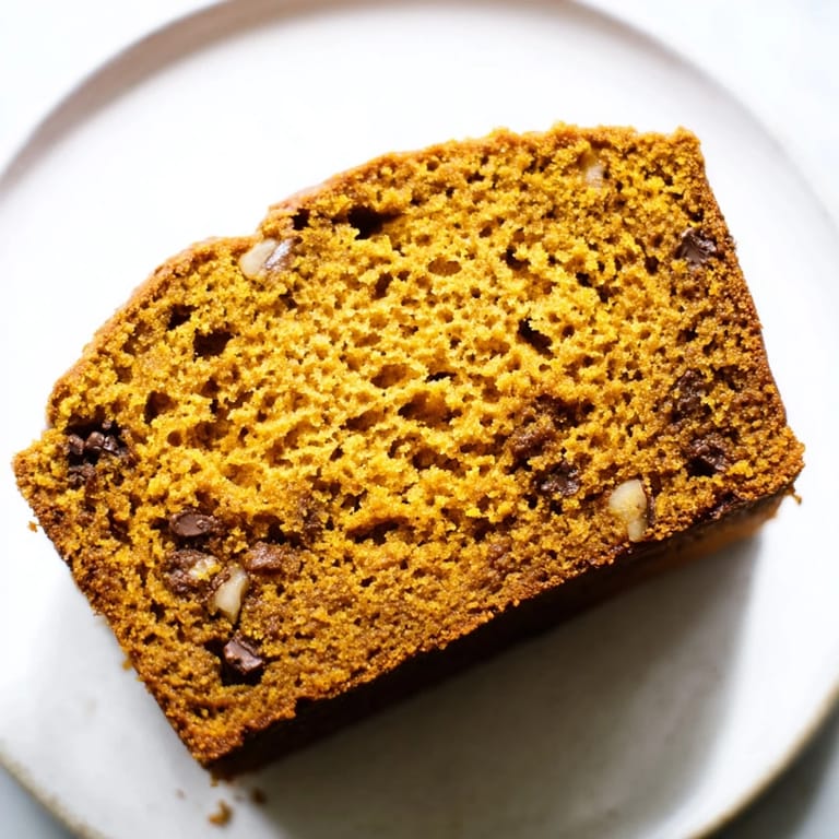 Whole Pumpkin Bread Loaf on a cooling rack, perfect for breakfast or afternoon snack.