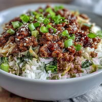Ground pork, cabbage, and carrots sizzle in a skillet for this savory Egg Roll in a Bowl. 