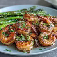 Vibrant one-pan lemon garlic shrimp and asparagus with fresh parsley and zesty lemon sauce.